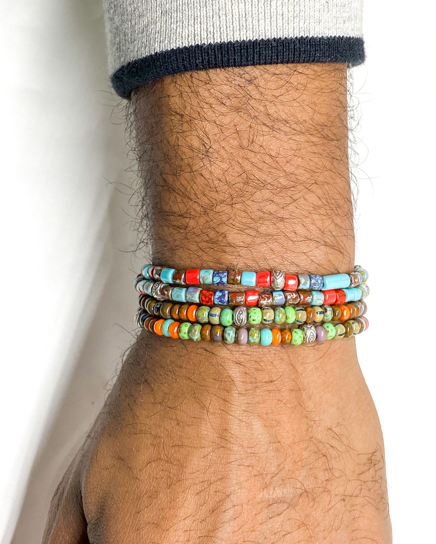 Men’s Bracelet with red and blue aged Picasso beads with silver.