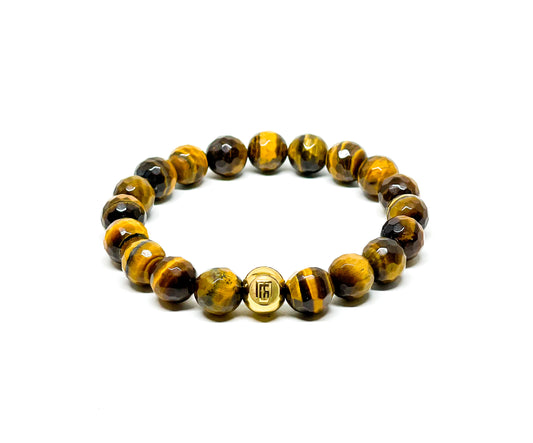 Men’s Bracelet with Tiger Eye Faceted and Gold plated over Stainless Steel logo bead.